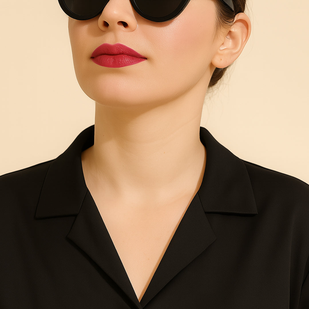 Woman in a black collared shirt with sunglasses, minimalist fashion style