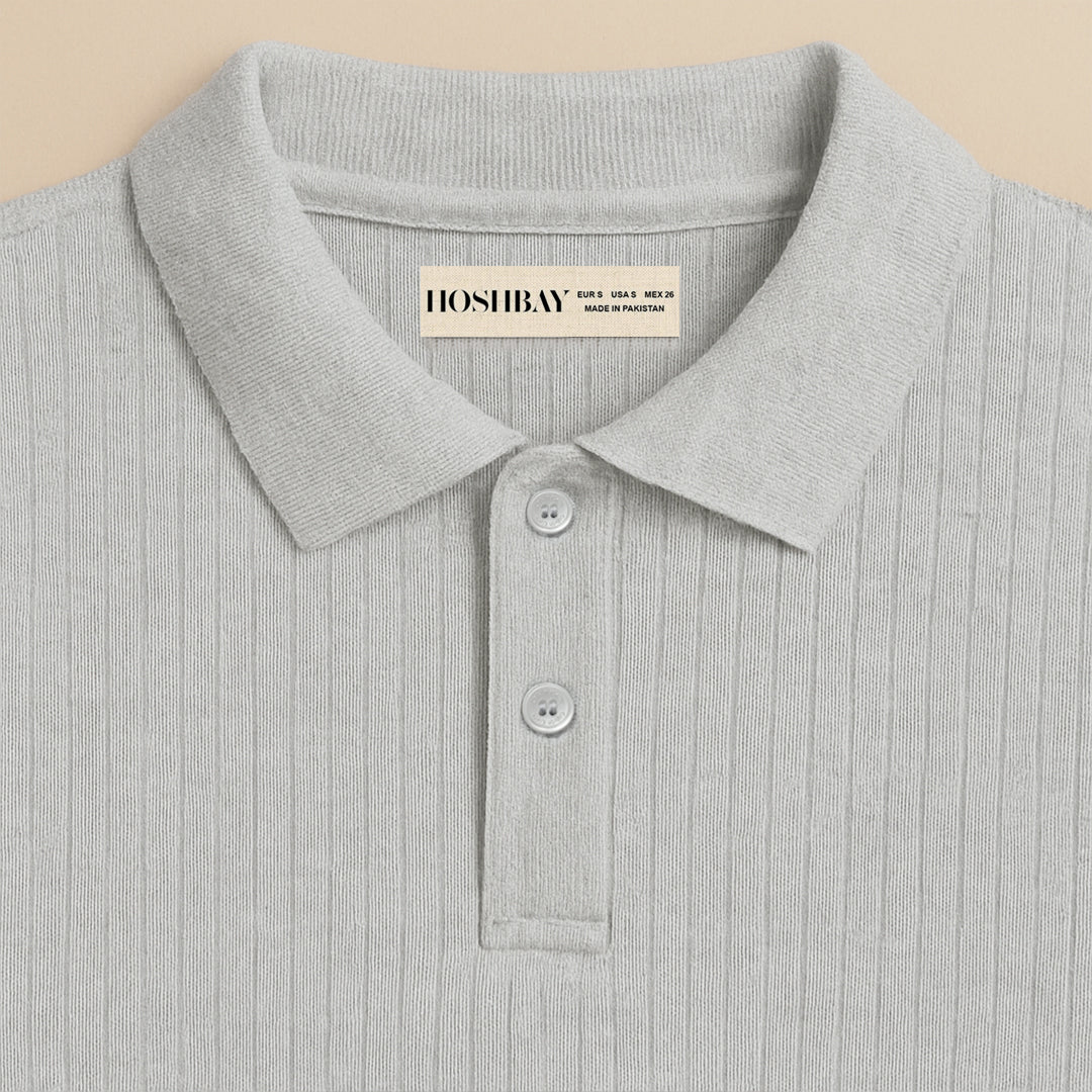Light grey ribbed polo shirt with buttons and collar, close-up front view
