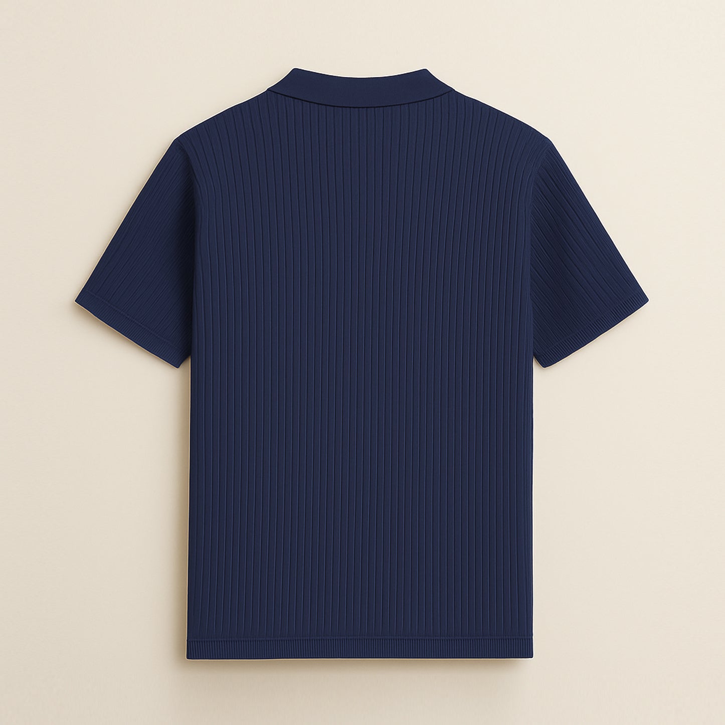 Back view of a navy blue ribbed short sleeve polo shirt on a beige background.