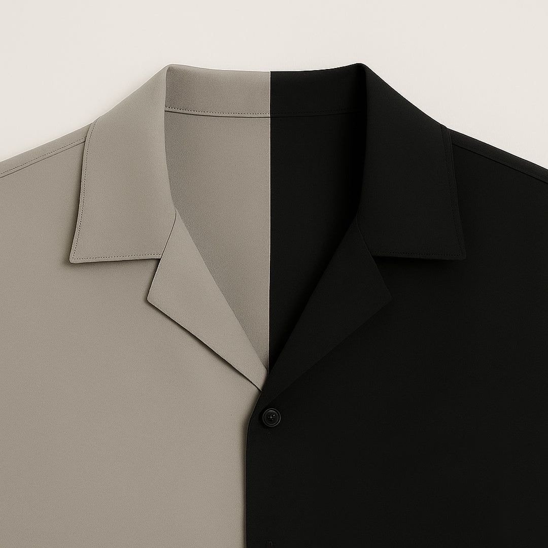 Woman wearing two-tone black and gray matching shirt and pants, accessorized with sunglasses, heels, and clutch, stylish modern fashion outfit.