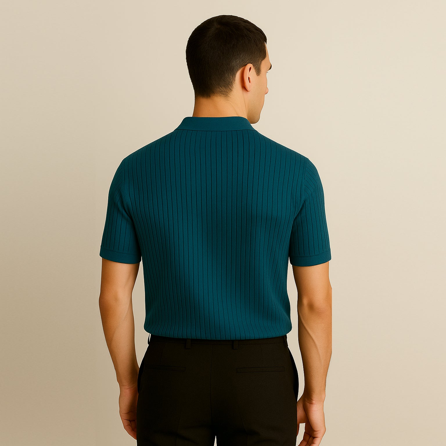 Man wearing teal ribbed short sleeve polo shirt and black pants, back view