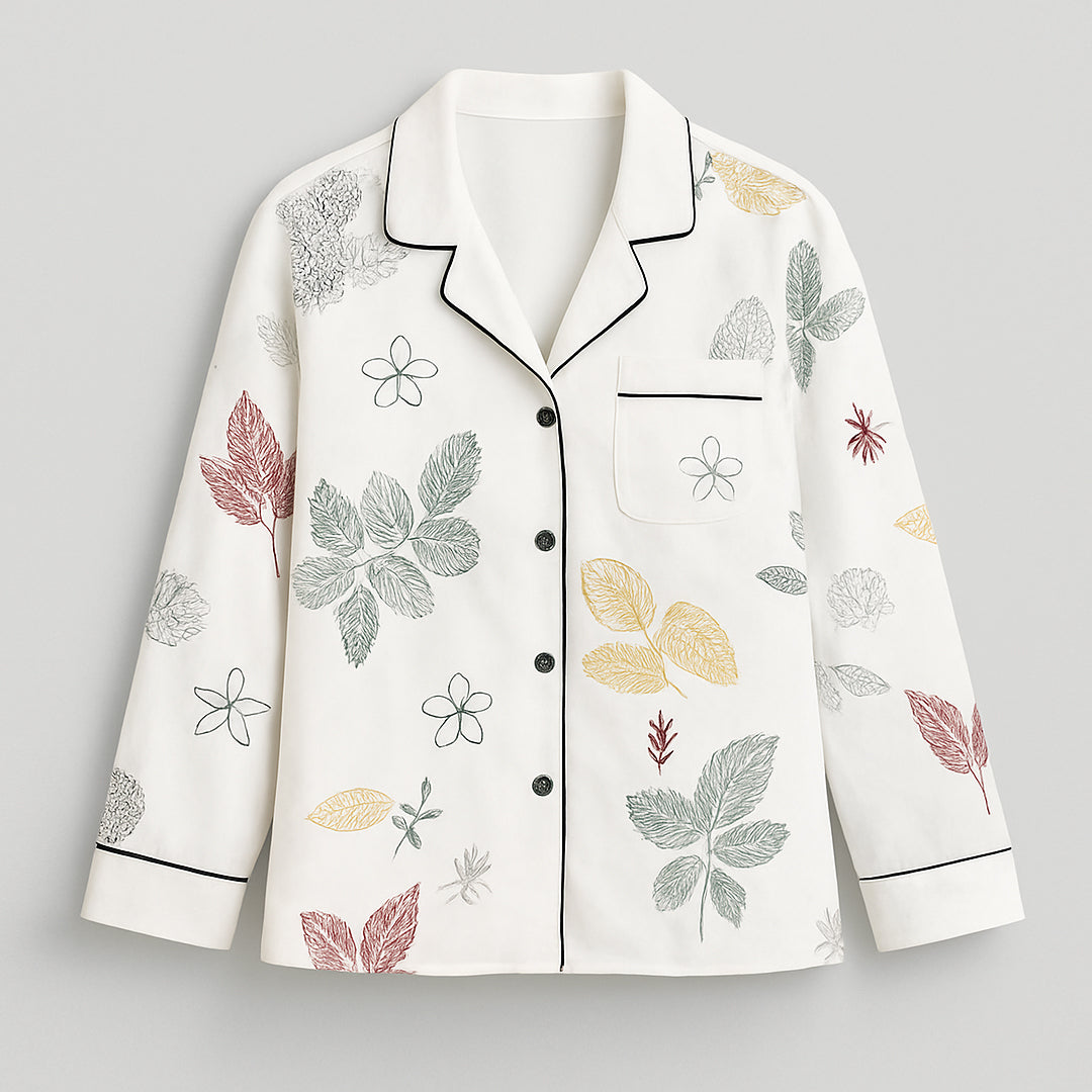 White women's button-up shirt with multicolored leaf and floral print, long sleeves