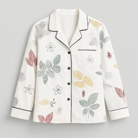 White women's button-up shirt with multicolored leaf and floral print, long sleeves