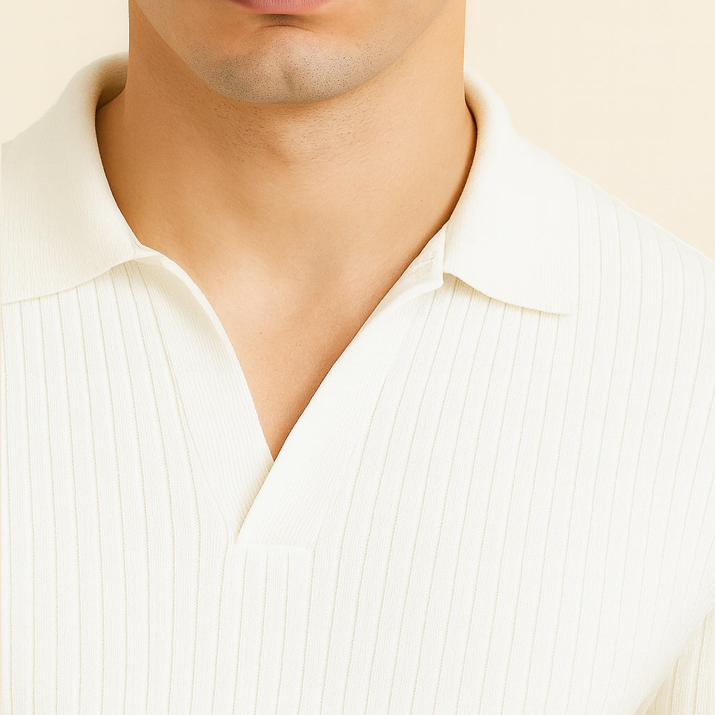 Close-up of a man wearing a white ribbed polo shirt with a spread collar